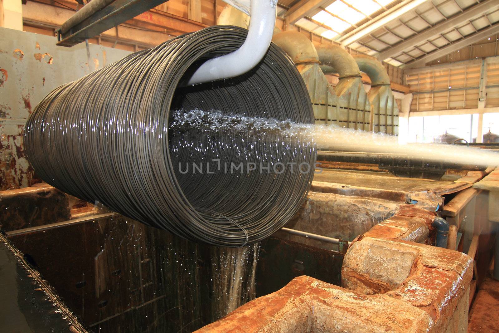 Large spools of Steel Coils being moved.