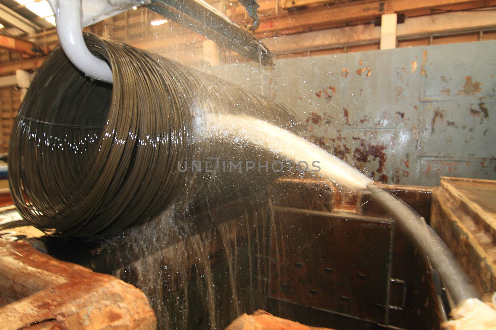 Large spools of Steel Coils being moved.