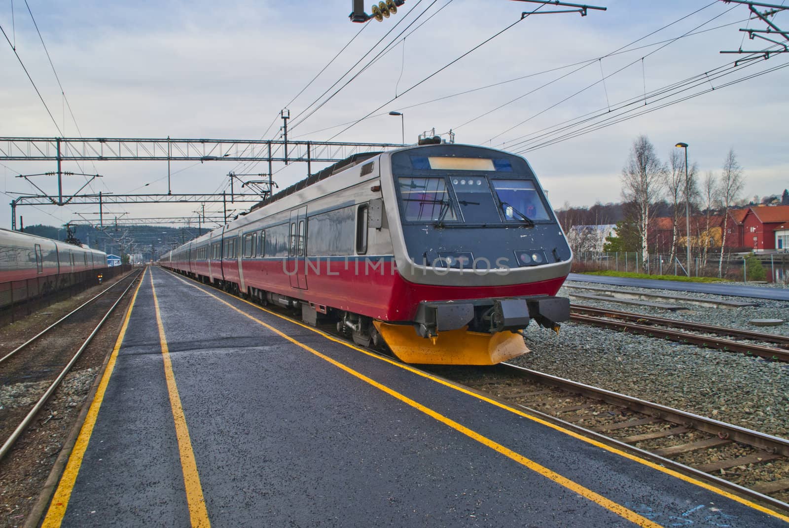 picture is shot in november 2012 at halden railroad station and shows nsb (in norwegian:  norges statsbaner) class 70 which is a four-carriage electric multiple unit, the train is used by nsb for medium distance trains around oslo, most in the dovre line between oslo and lillehammer / dombås and on the vestfold line
