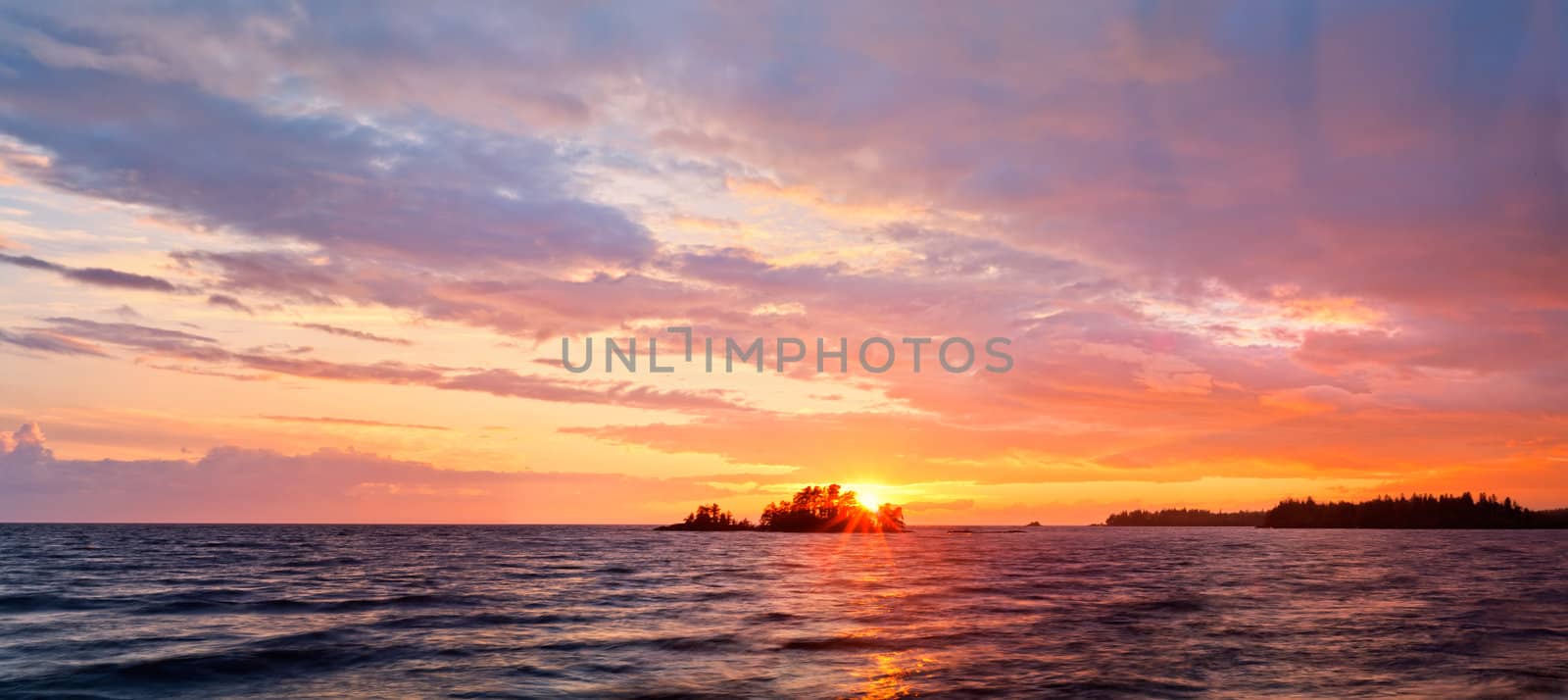 Sea at sunset with some motion blur water, the sky is in beautiful dramatic color