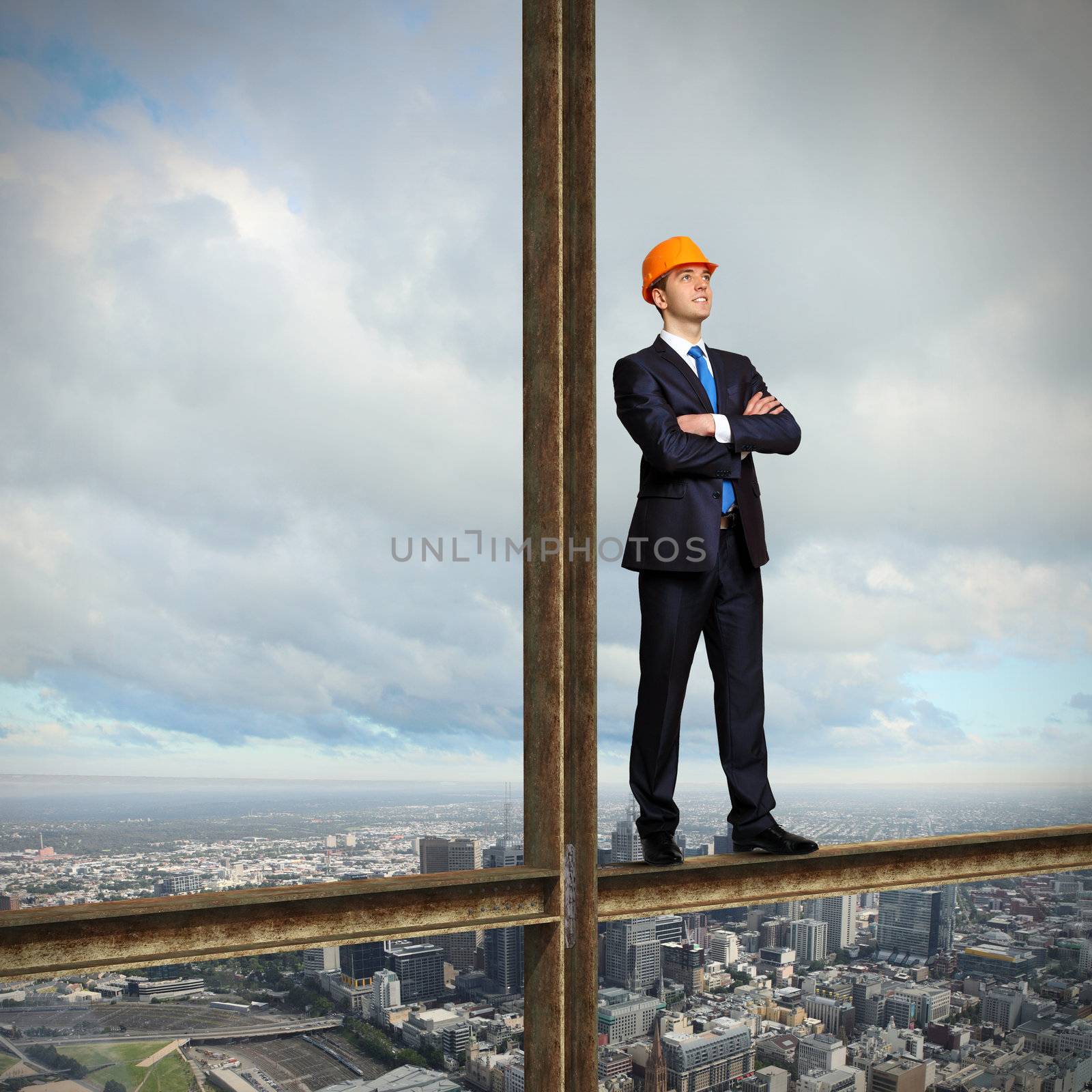 Businessman standing in suit on the construction site