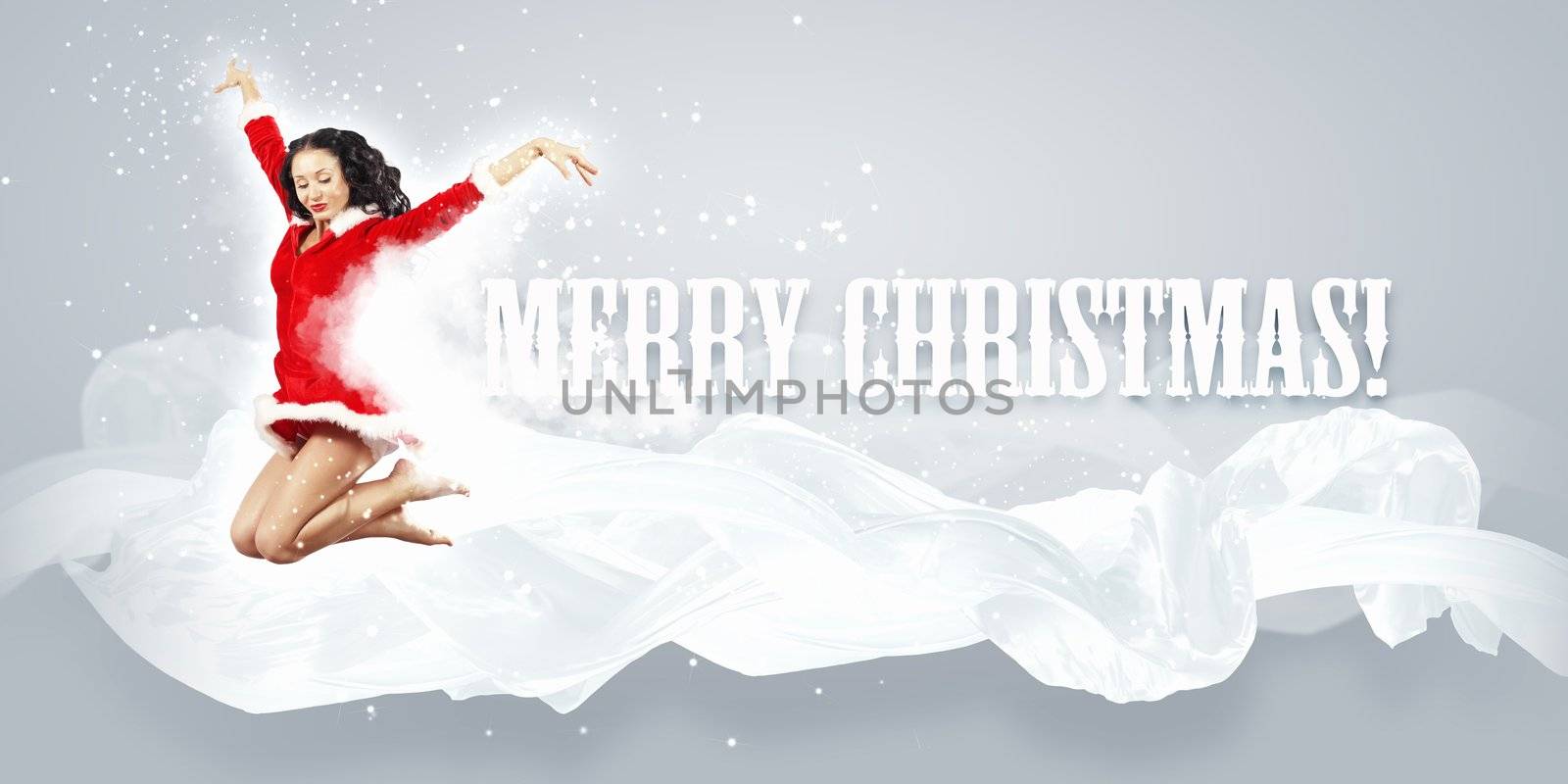 Happy smiling woman in red xmas costume jumping high