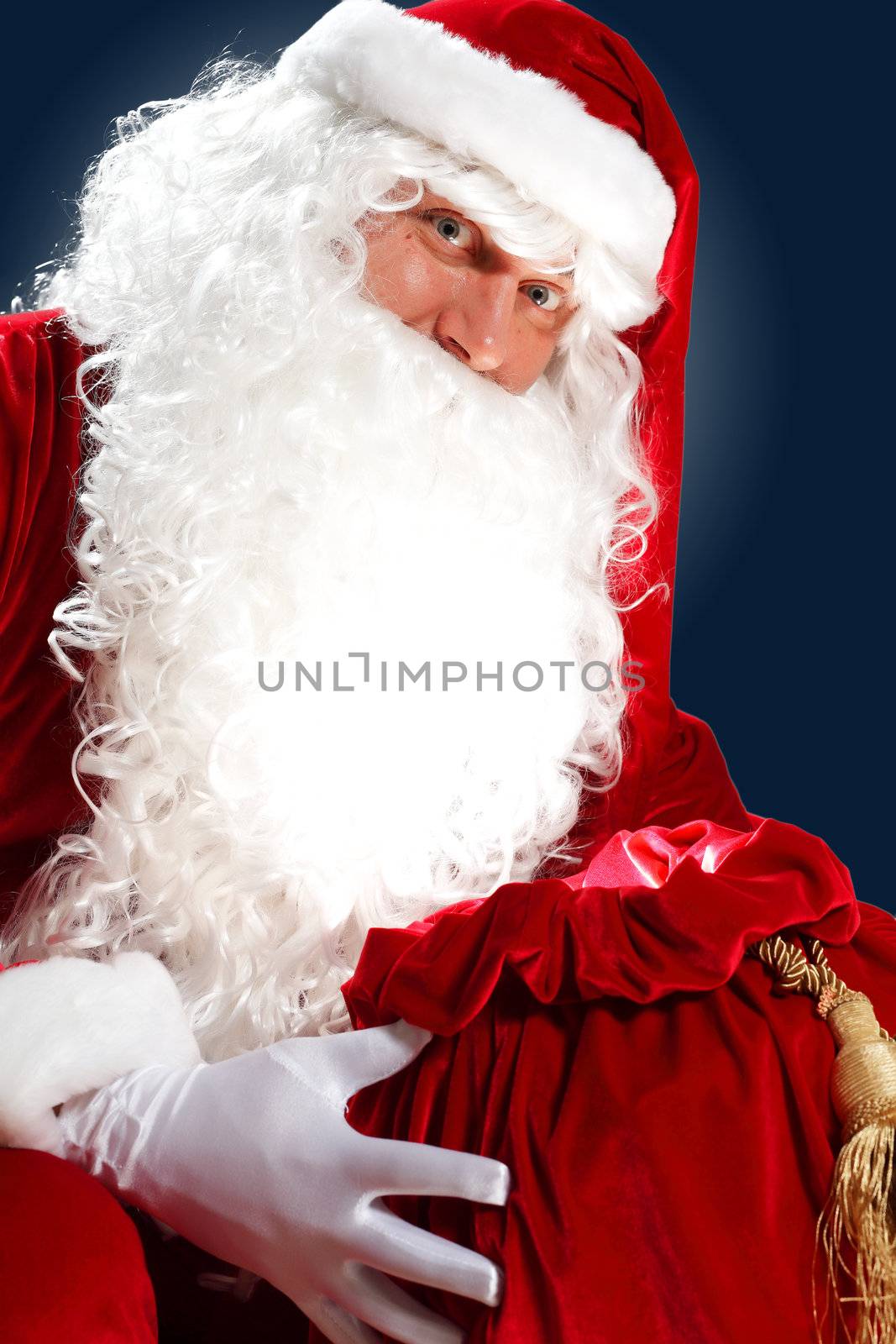 Santa Claus with his magic gift red bag full of presents