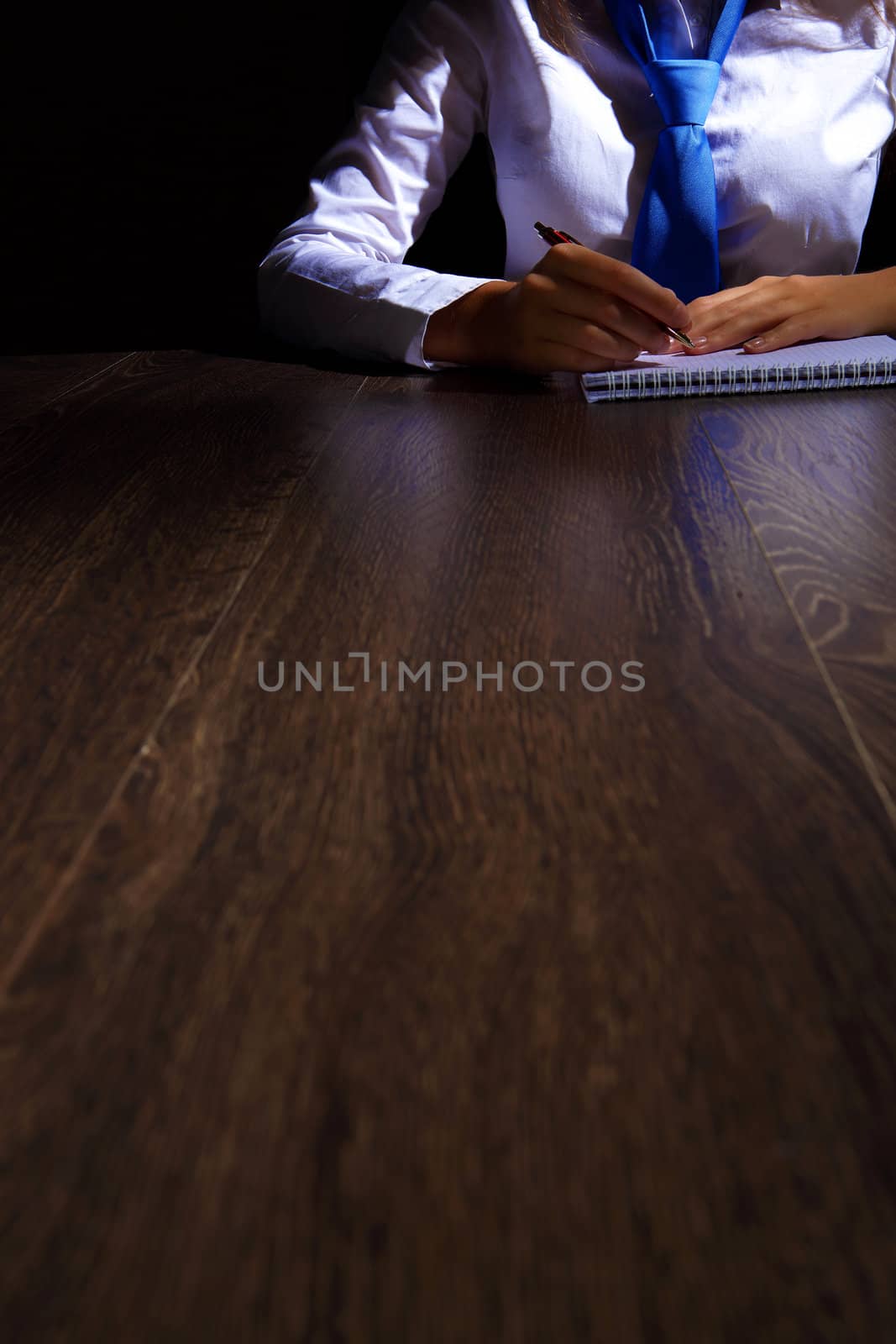 Business woman at office sitting at table and working