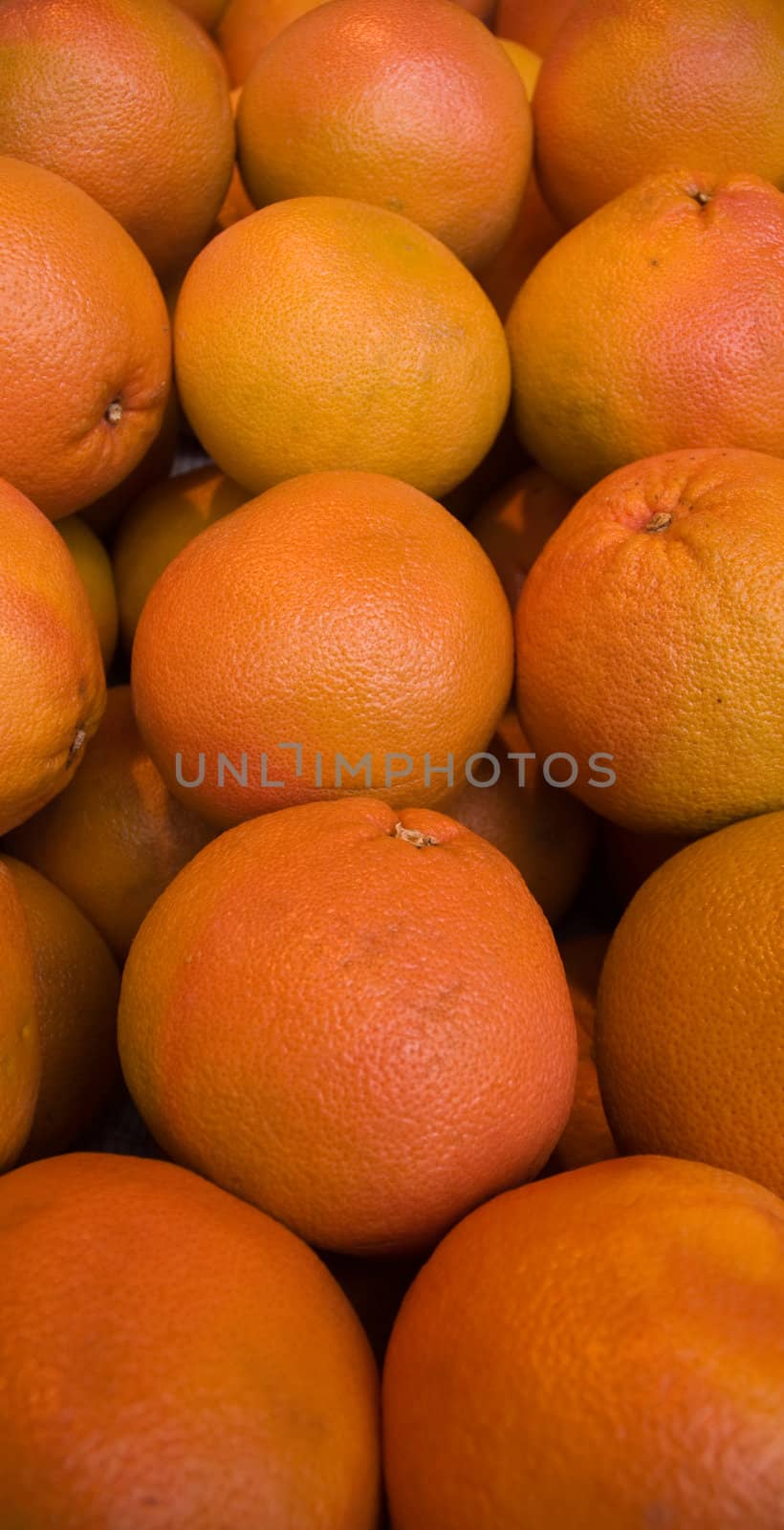 Fresh natural oranges to background .