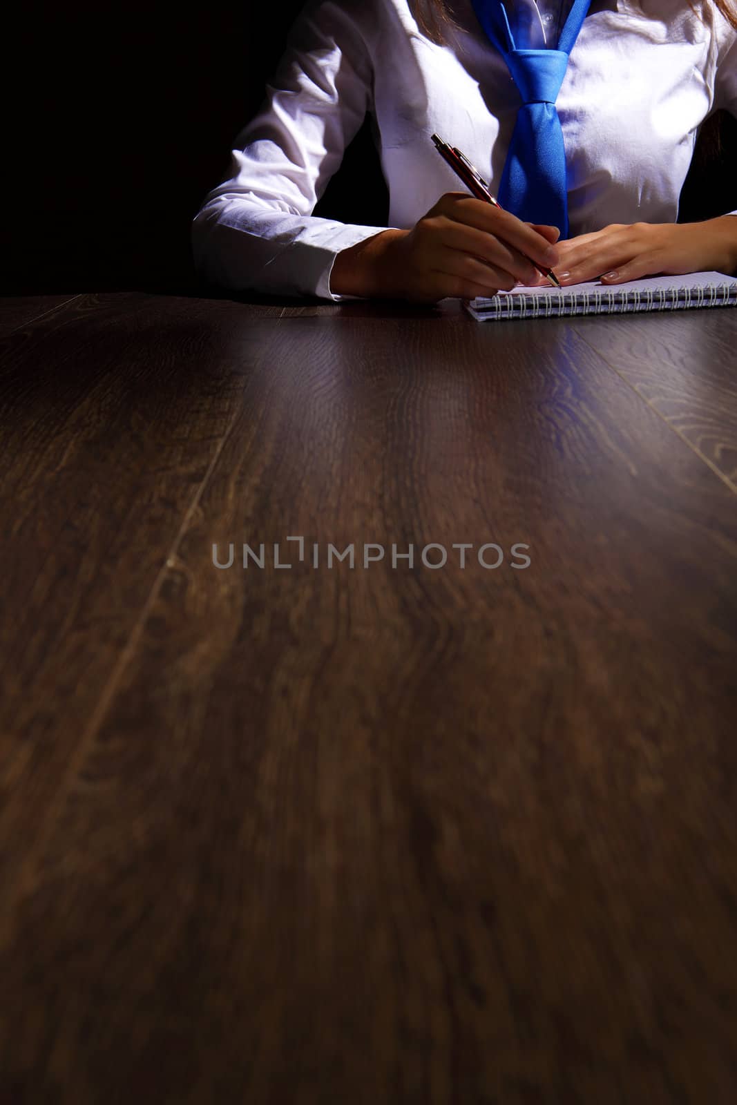 Business woman at office sitting at table and working