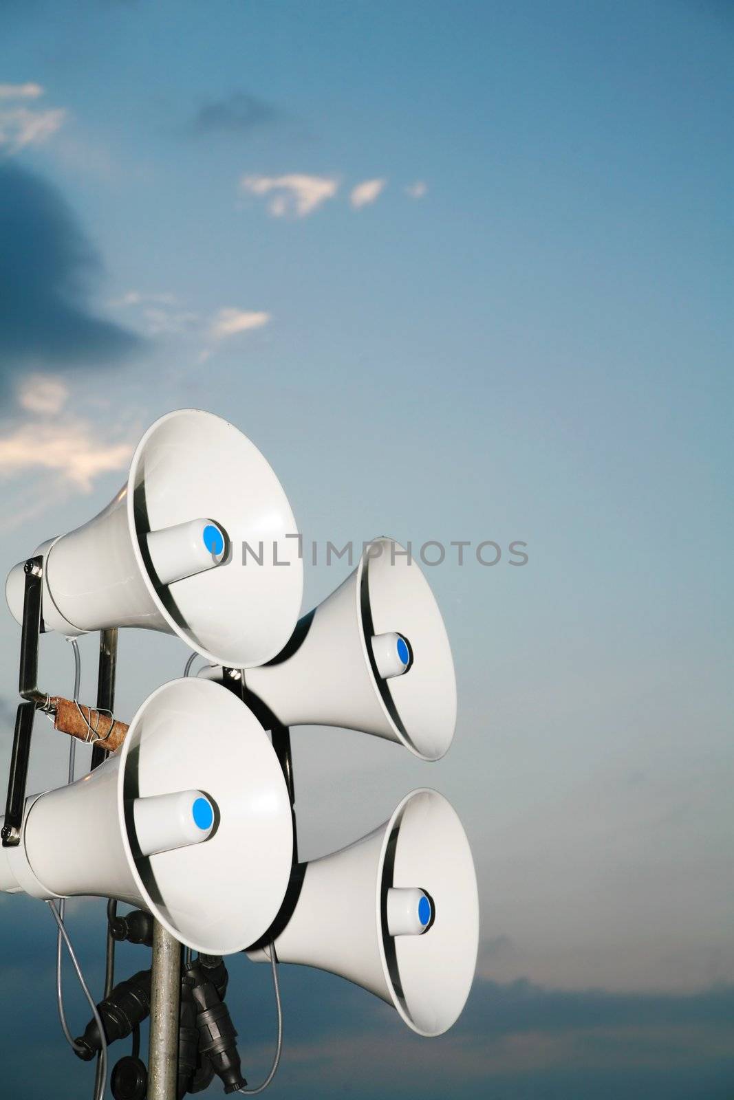 Loudspeaker against the sky clouds out side