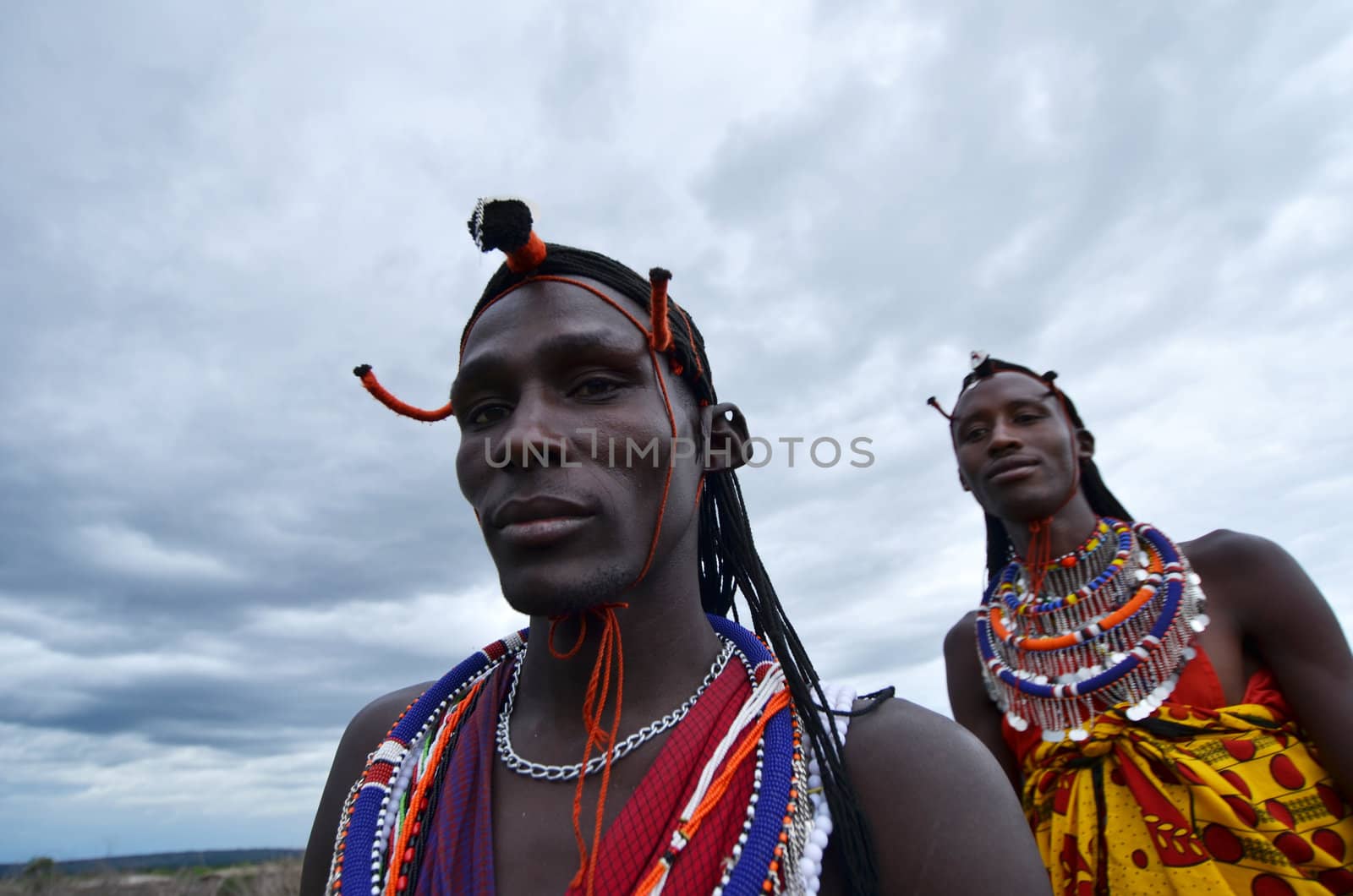 Village Masai Mara, Kenya – October  17, 2011: young Masai warrior is seen in his ceremonial dress.