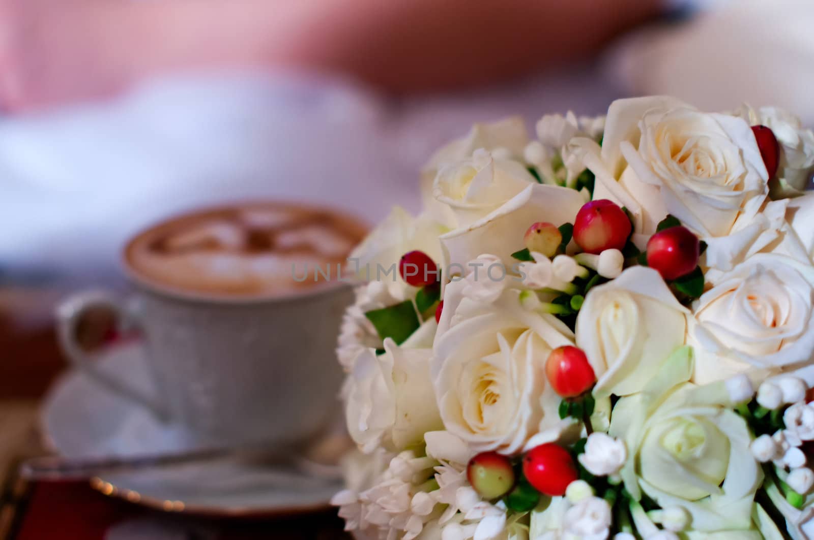 love cup , heart drawing on latte art coffee and wedding bouquet