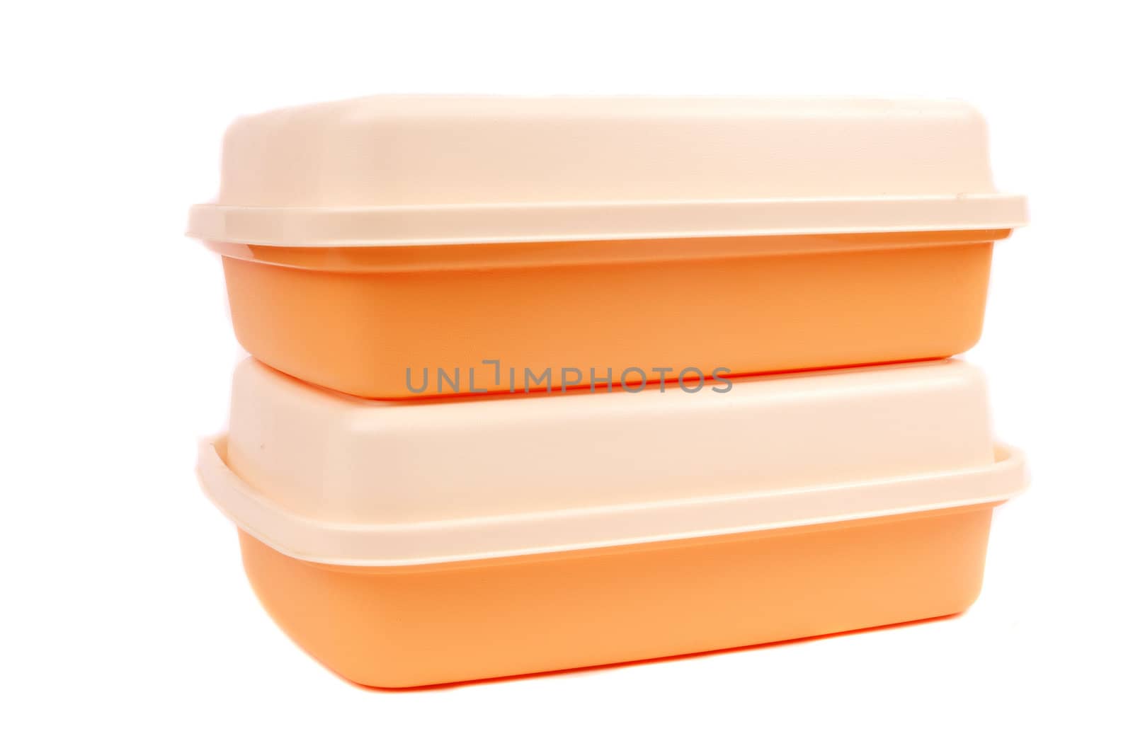 stack of orange storage plastic containers isolated on white background
