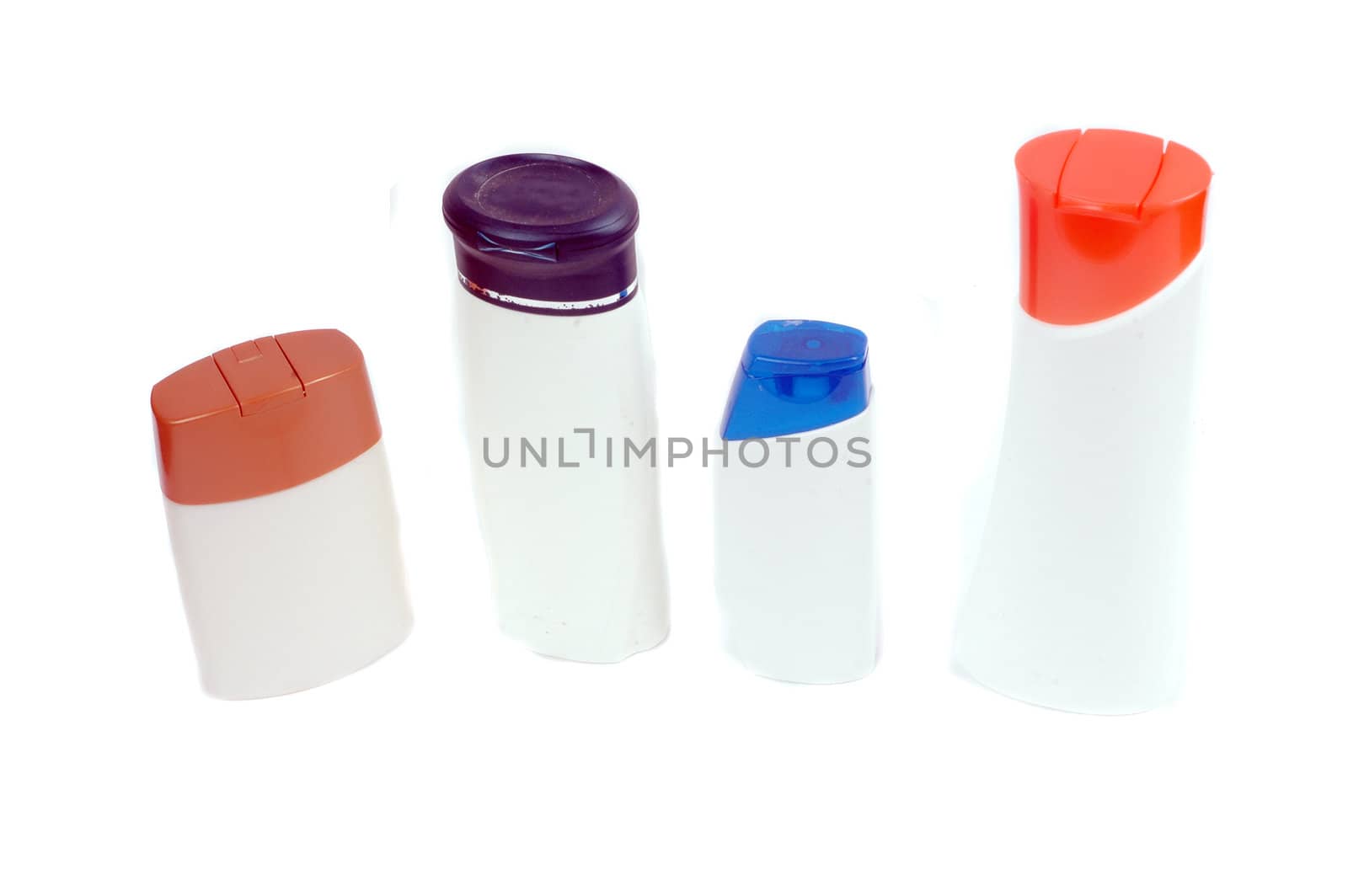 four plastic containers for bath fixtures isolated on white background