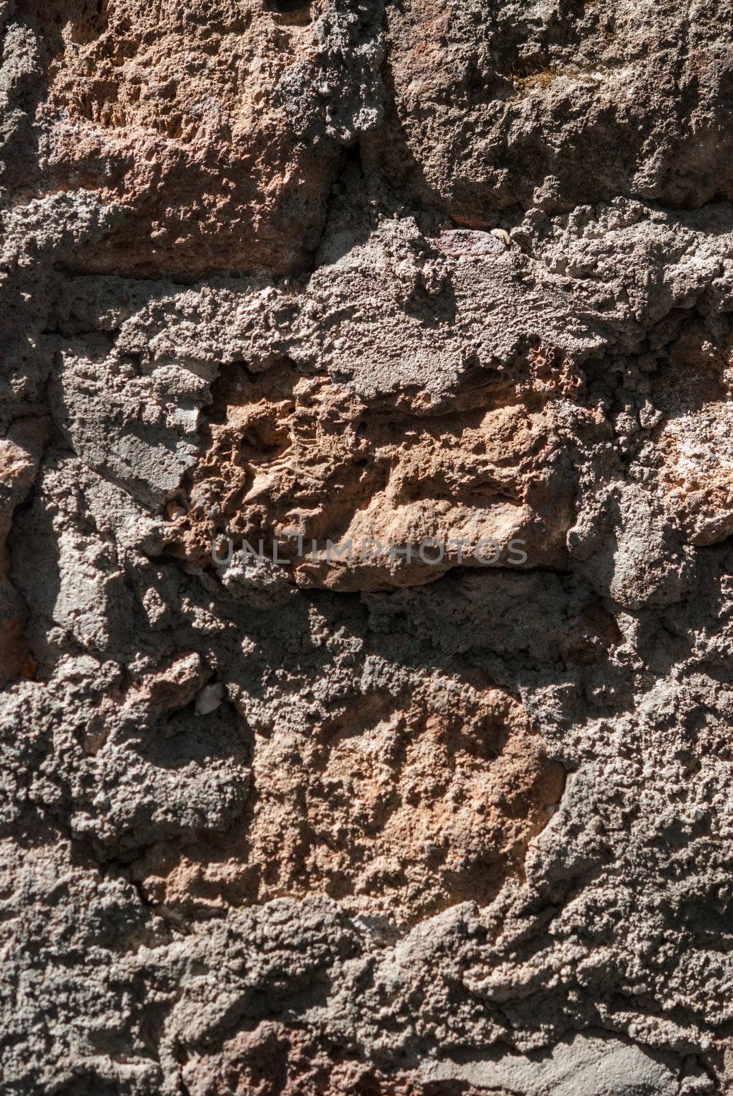 Surface of Textured stonework background. Brown tint