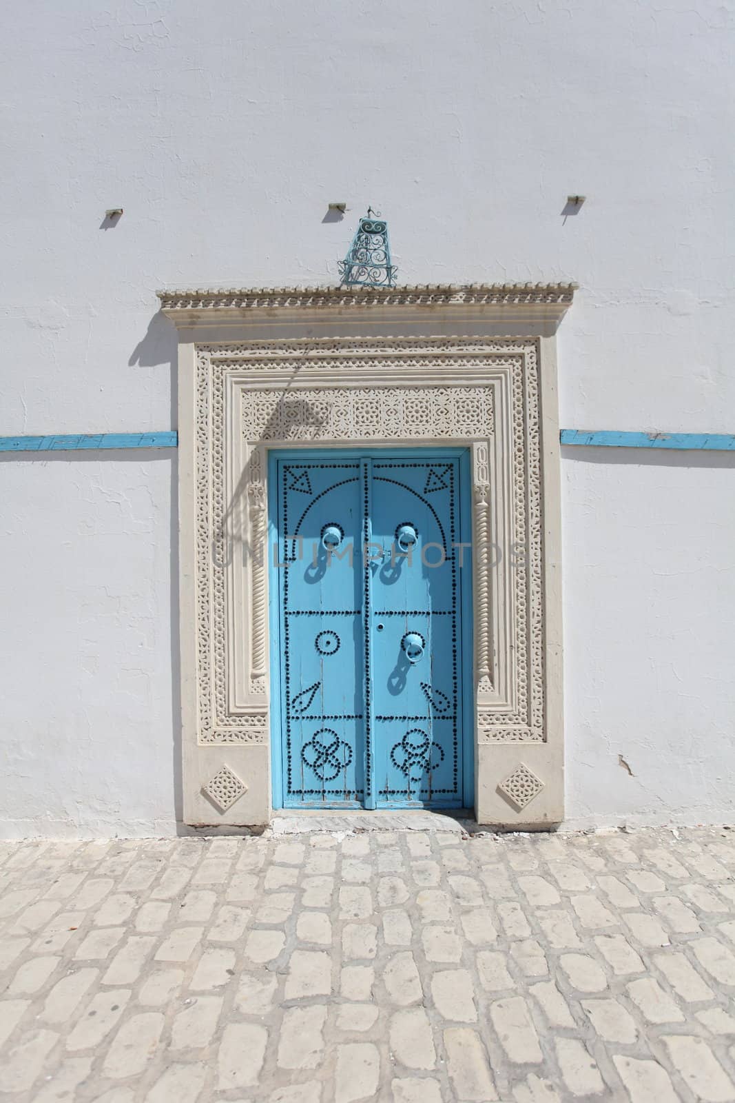 Blue door and wall in Sfaks , Tunisia.