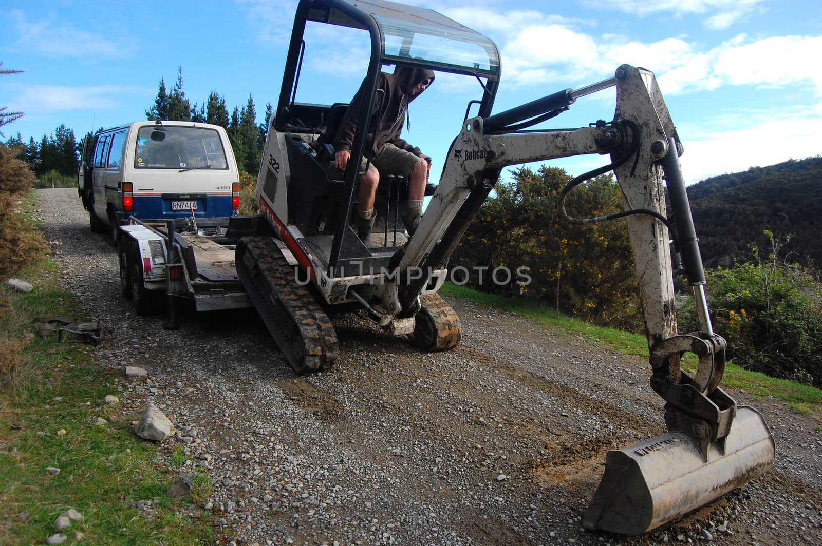 Man working on excavator, near Christchurch, New Zealand