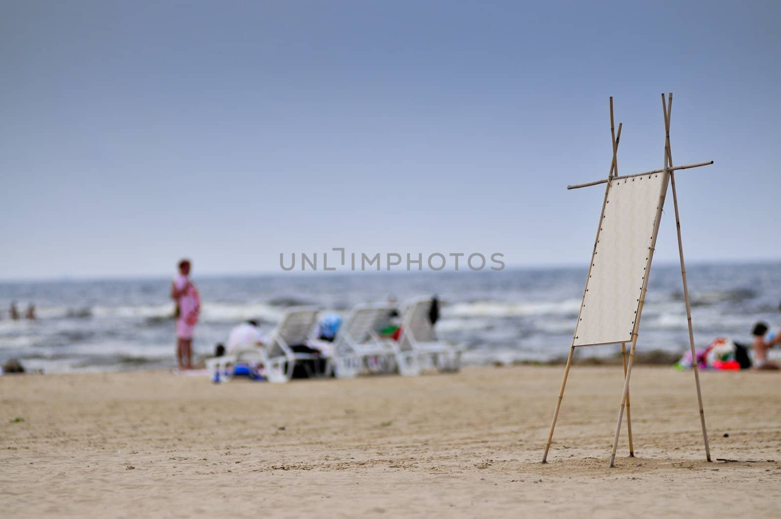 Menu board on sand of beach