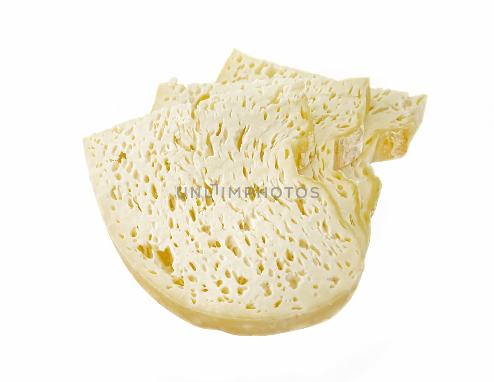 slices of Romanian traditional cheese with holes isolated on white
