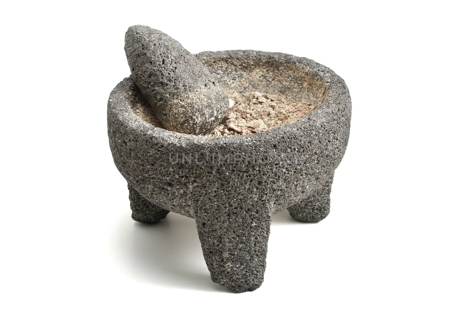 Stone mortar and pestle with ground potato on white background