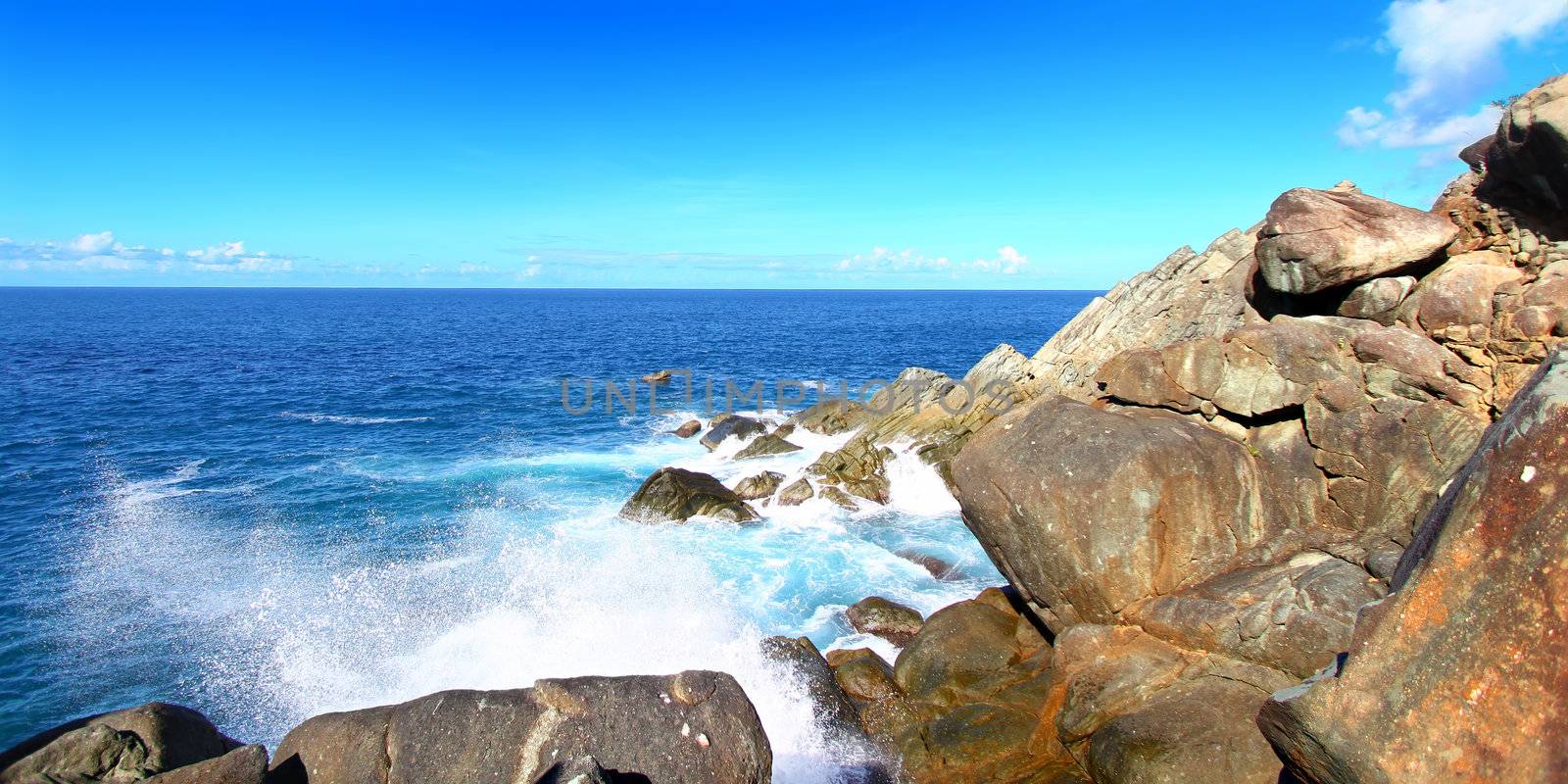 Waves crash over huge boulders at Shark Bay National Park in the British Virgin Islands.