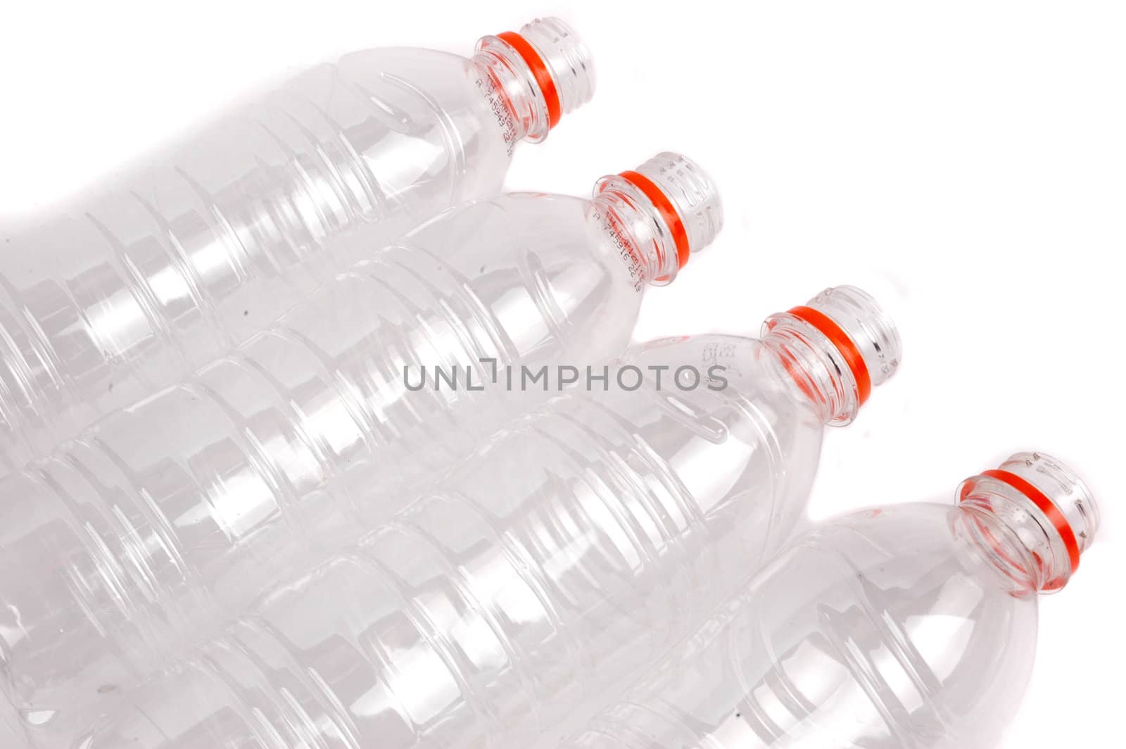 four opened plastic bottles isolated on white background