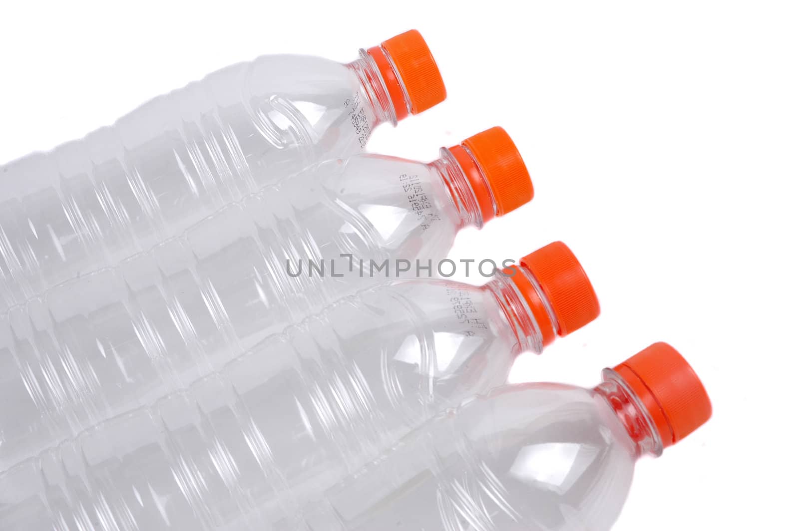 four closed plastic bottles isolated on white background