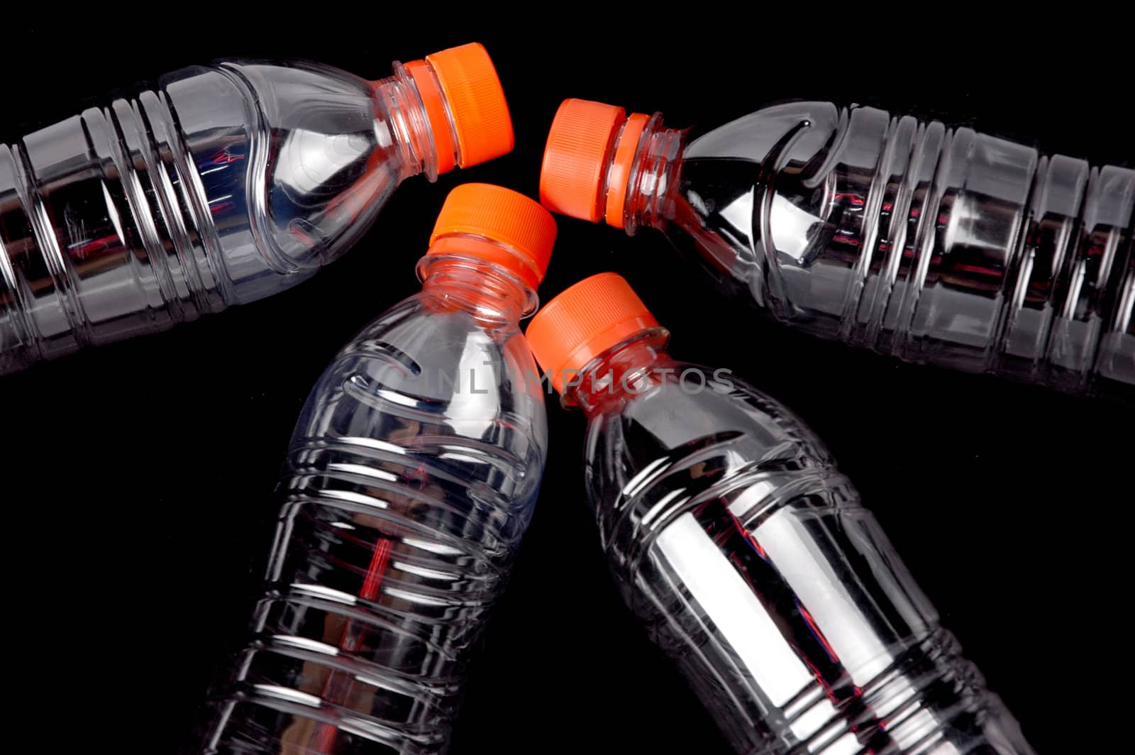 four closed plastic bottles by antonihalim