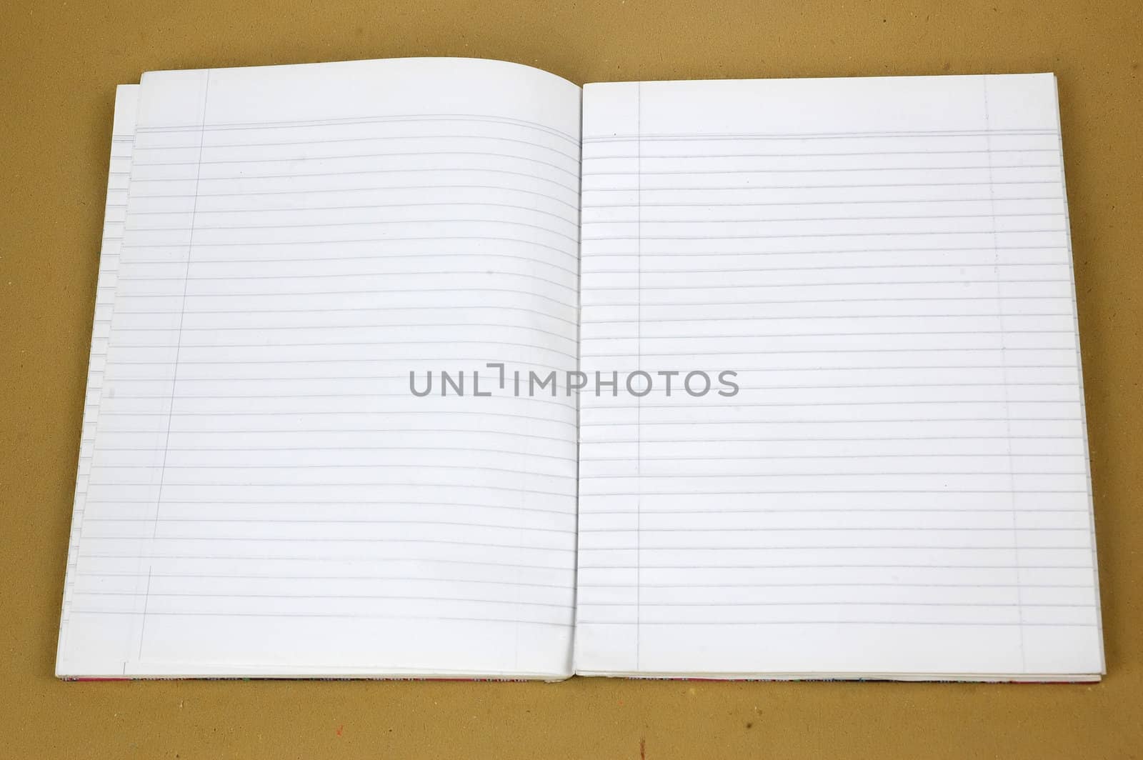 a blank book striped open with brown background