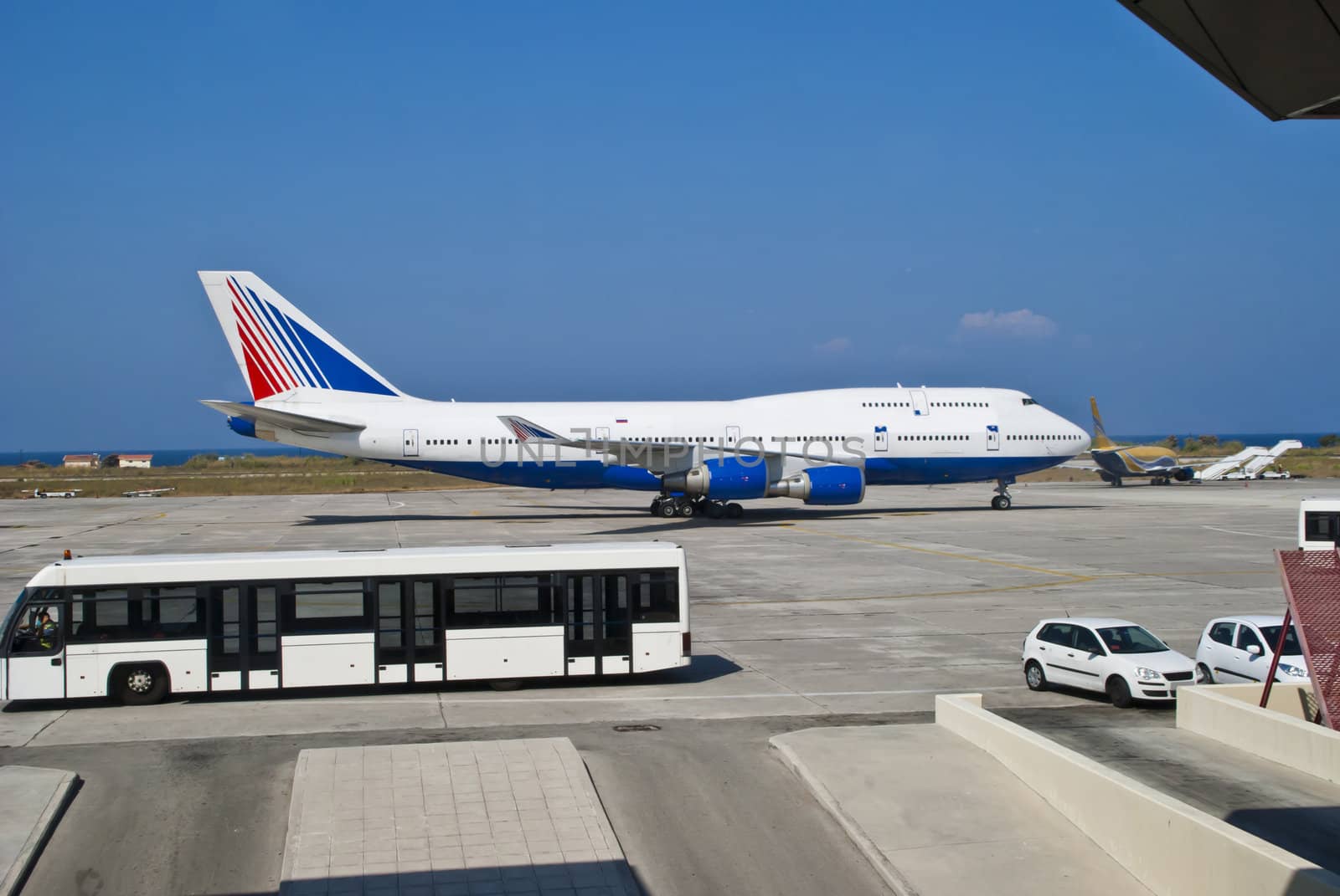 Boeing 747, also known by the nickname Jumbojet, is the world's second largest passenger aircraft after Airbus A380. Picture are shot from the departure hall at Rhodes airport. 