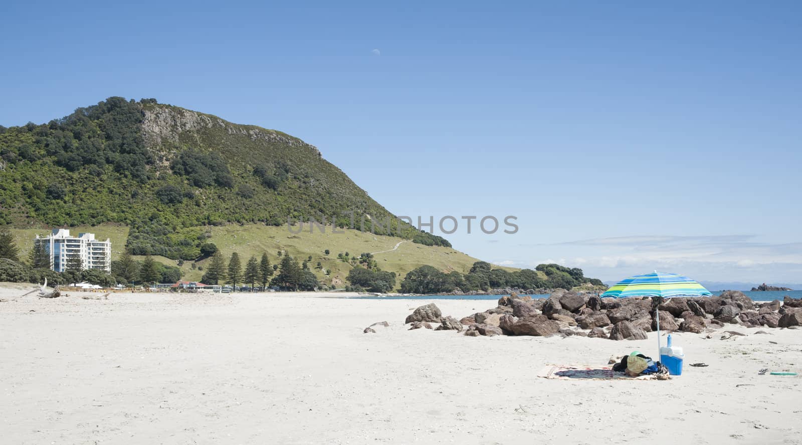 White sandy beach with Mount Maunganui
