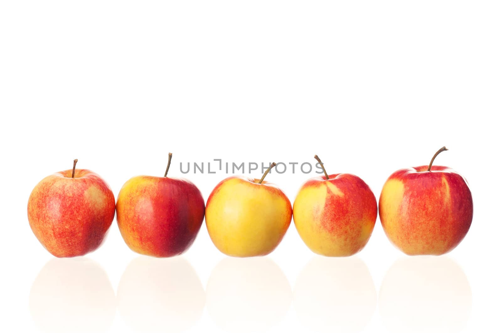 Fresh ripe red and yellow apples on white background