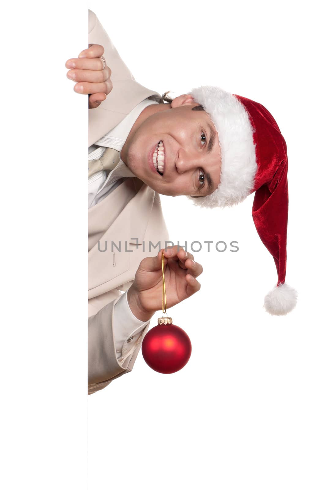 Portrait of handsome man in santa hat with blank billboard on white background