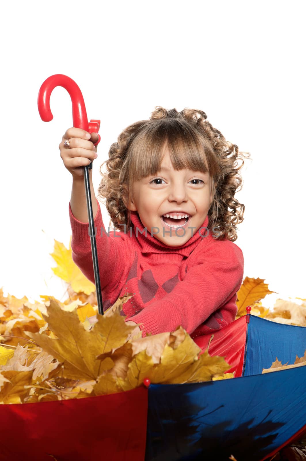 Portrait of a little girl holding an umbrella posing on white