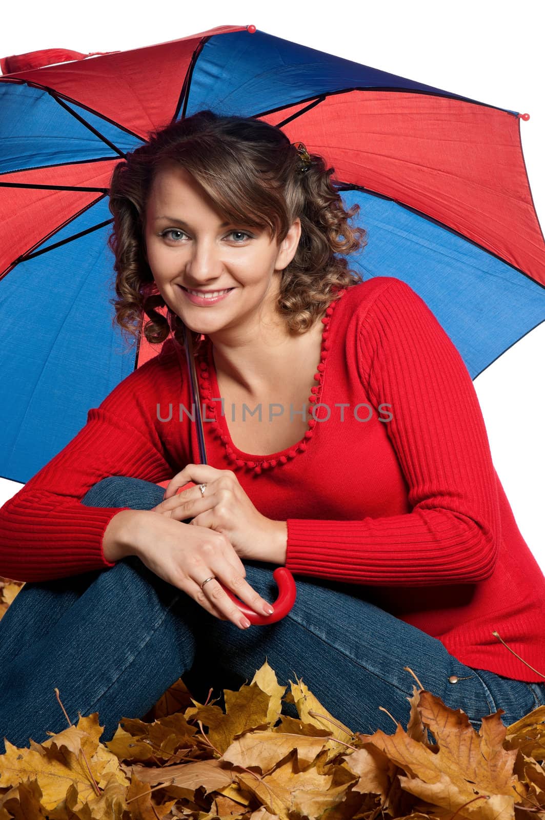 Portrait of a young woman holding an umbrella posing on white