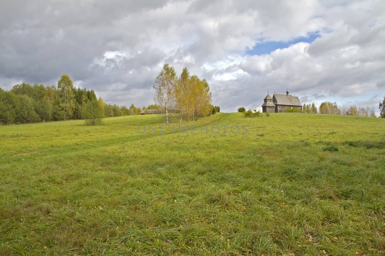 Autumn rural landscape with a church in the background