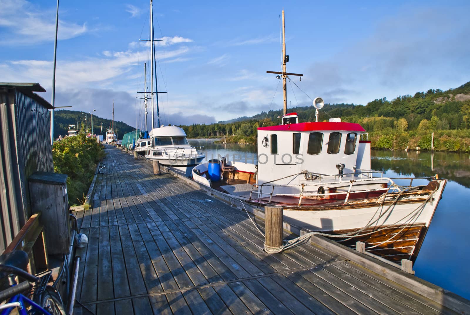 sjark boat is a type of light fishing and shuttle boat with room for a single fisherman and is common along the coast of norway, but it is mostly coastal fishermen with sjark in northern norway, the boat is moored to the pier in tista river in halden.