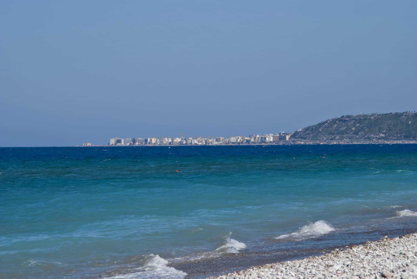Image is shot from the beach to Hotel Sun Beach Resort in Ixia, Rhodes