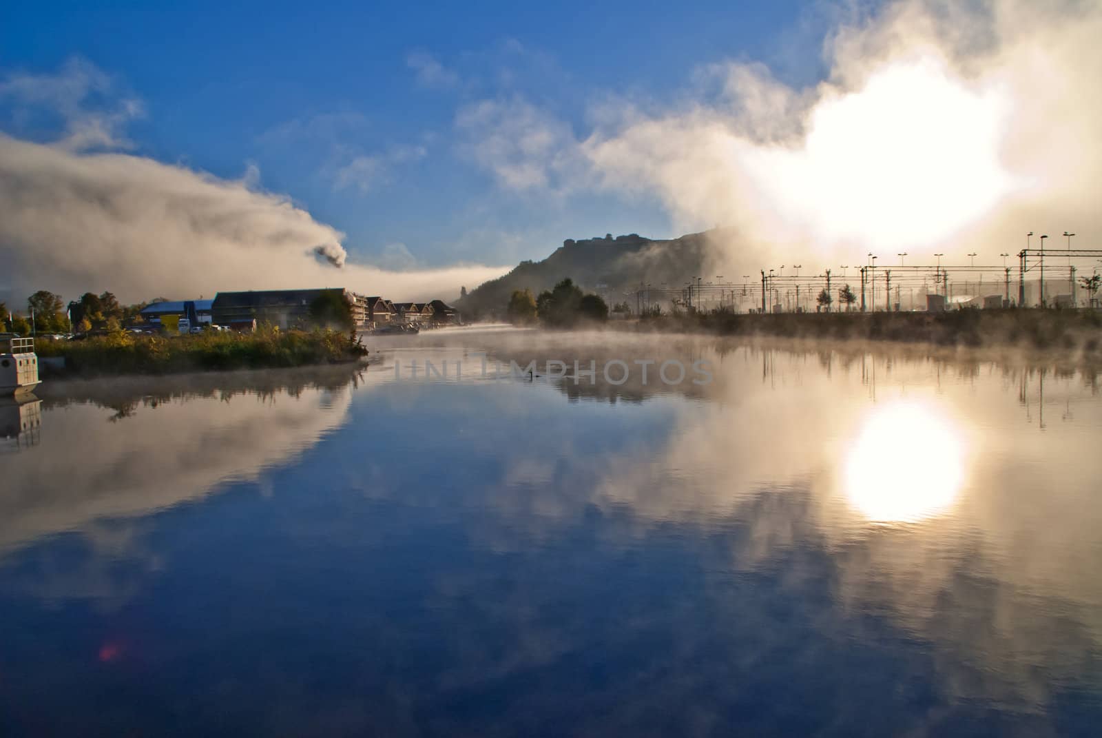 fog and smoke in the tista river in halden, image is shot on a cold autumn morning.