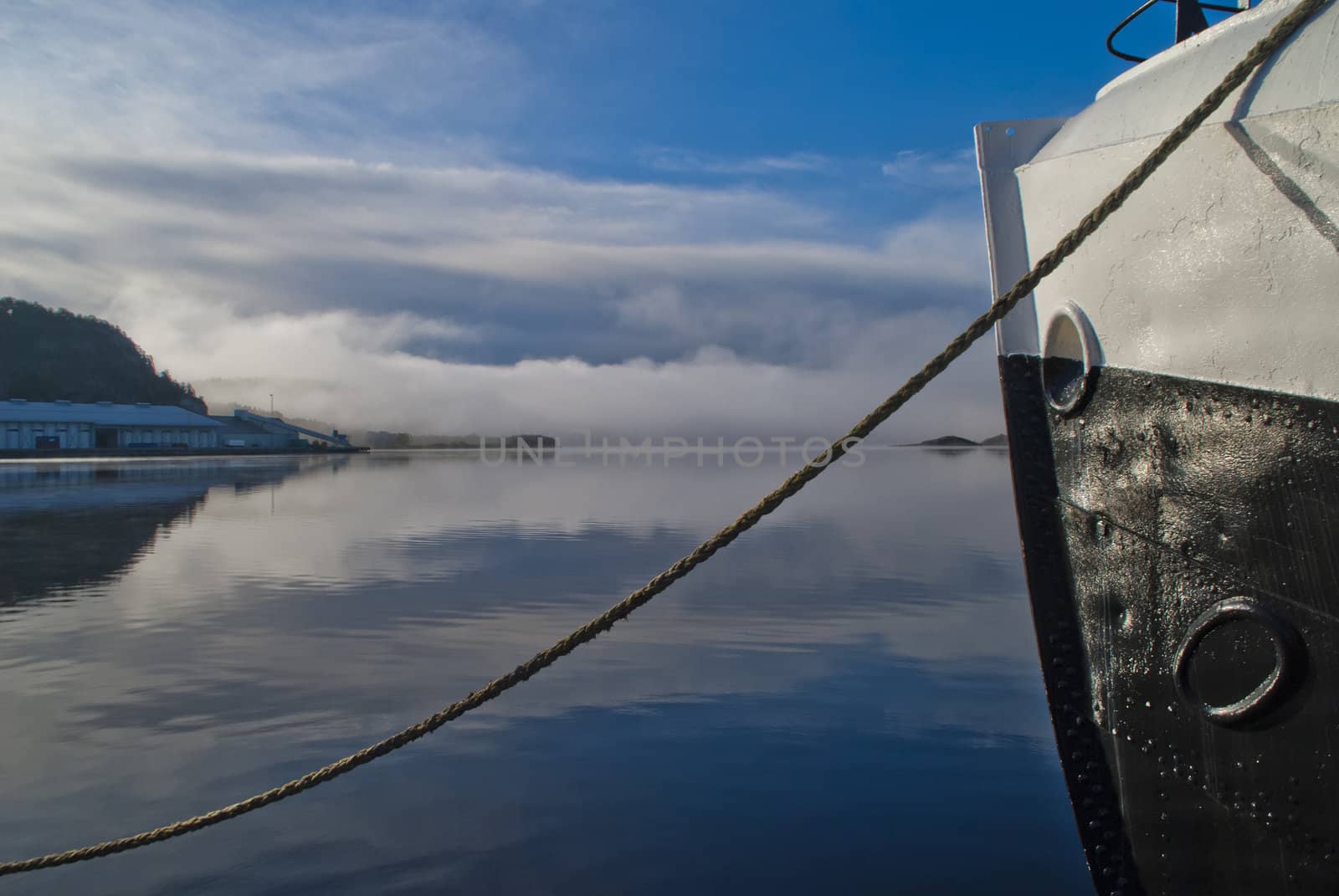 the boat is moored to the dock at the port of halden