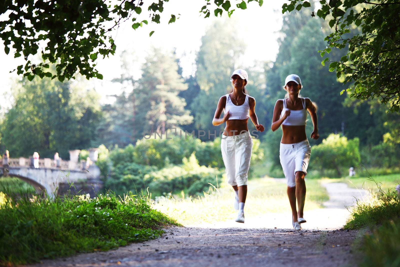 women run by sunny park alley