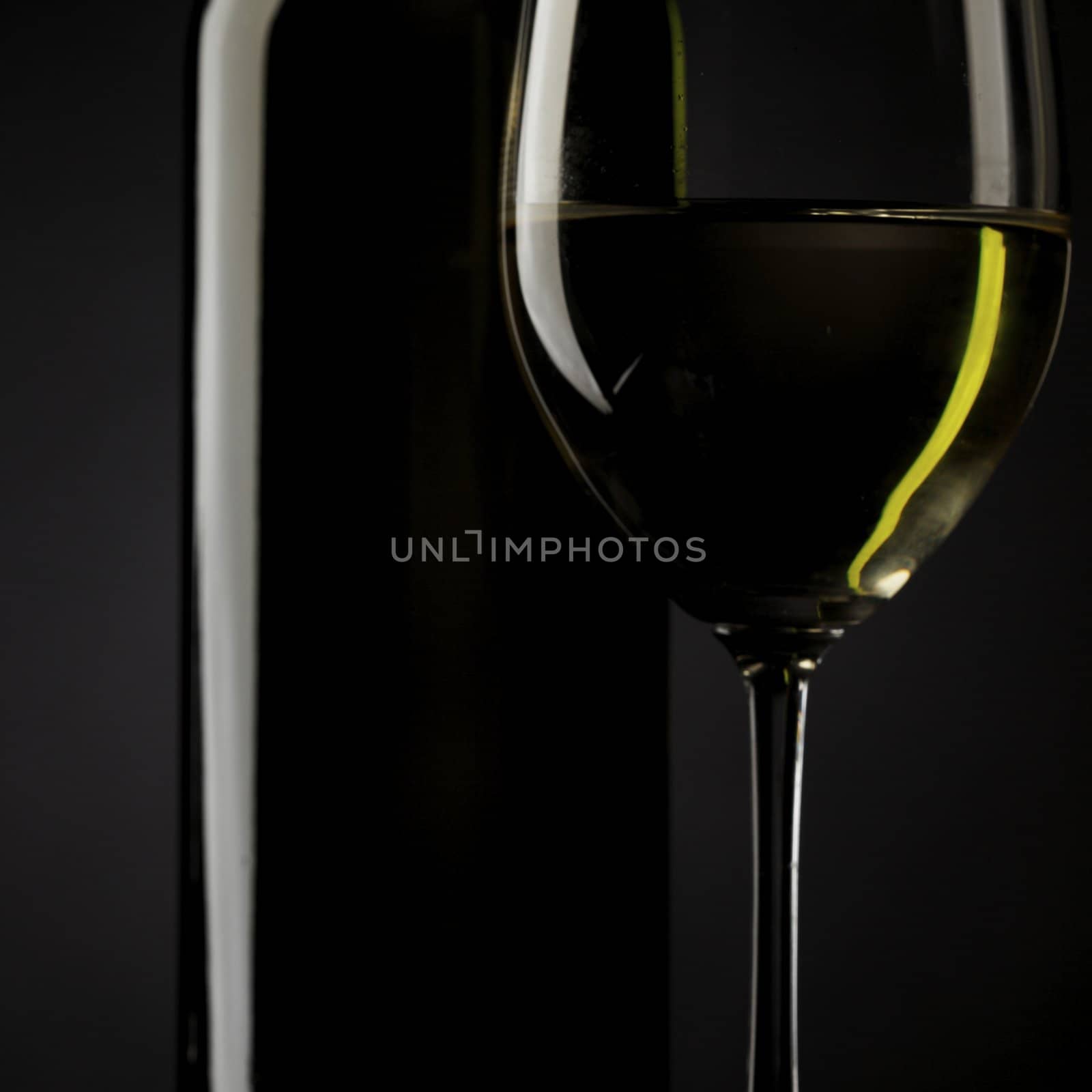 white wine glass silhouette black background