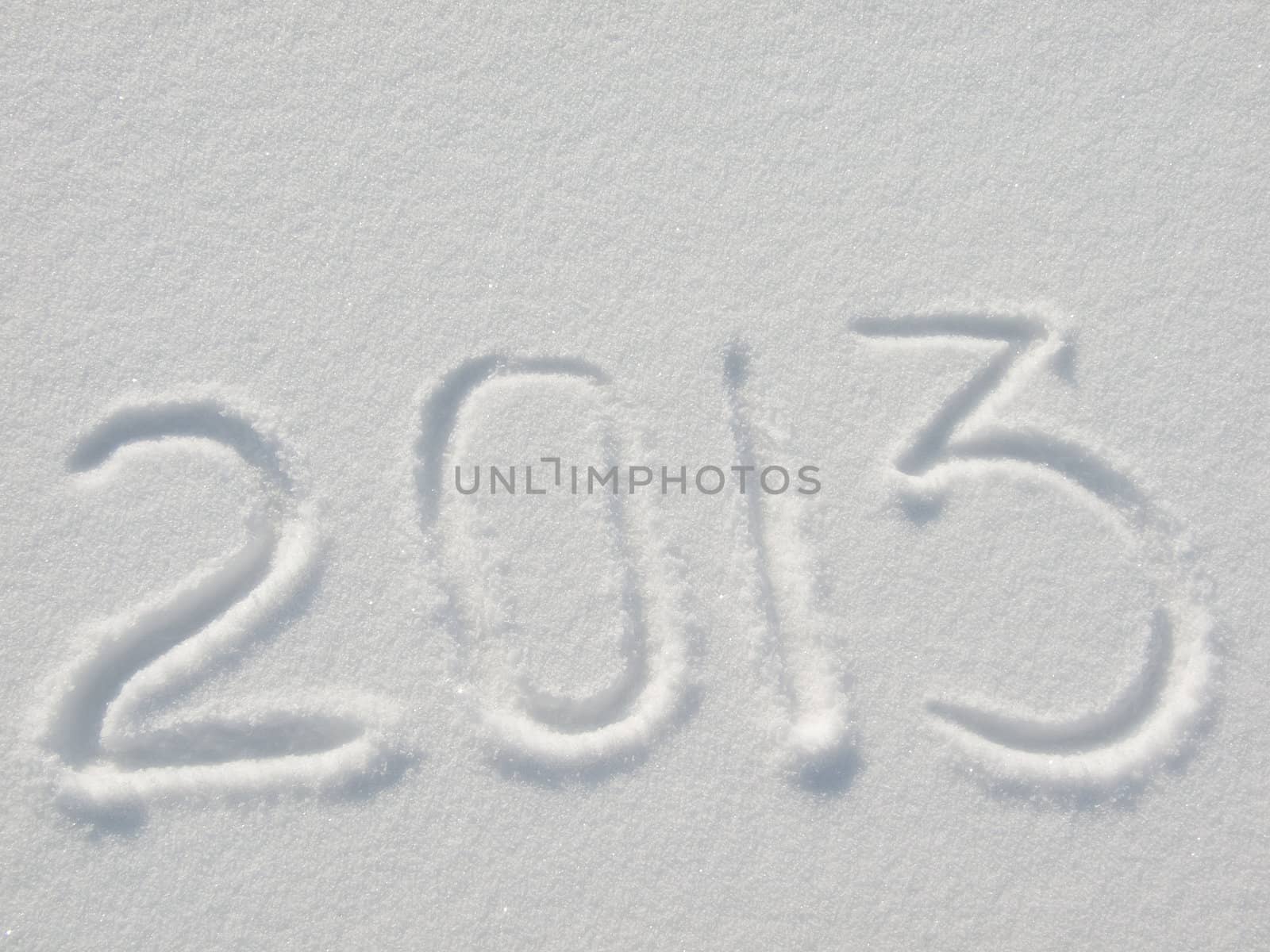 Message handwritten in fresh powdery natural snow for 2013