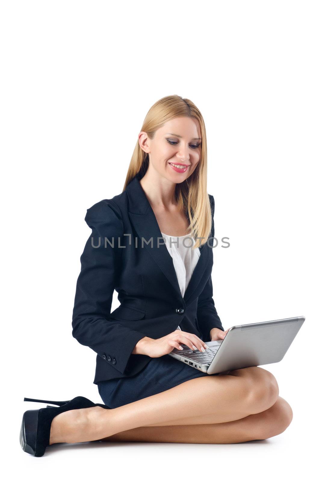Businesswoman sitting on floor with laptop