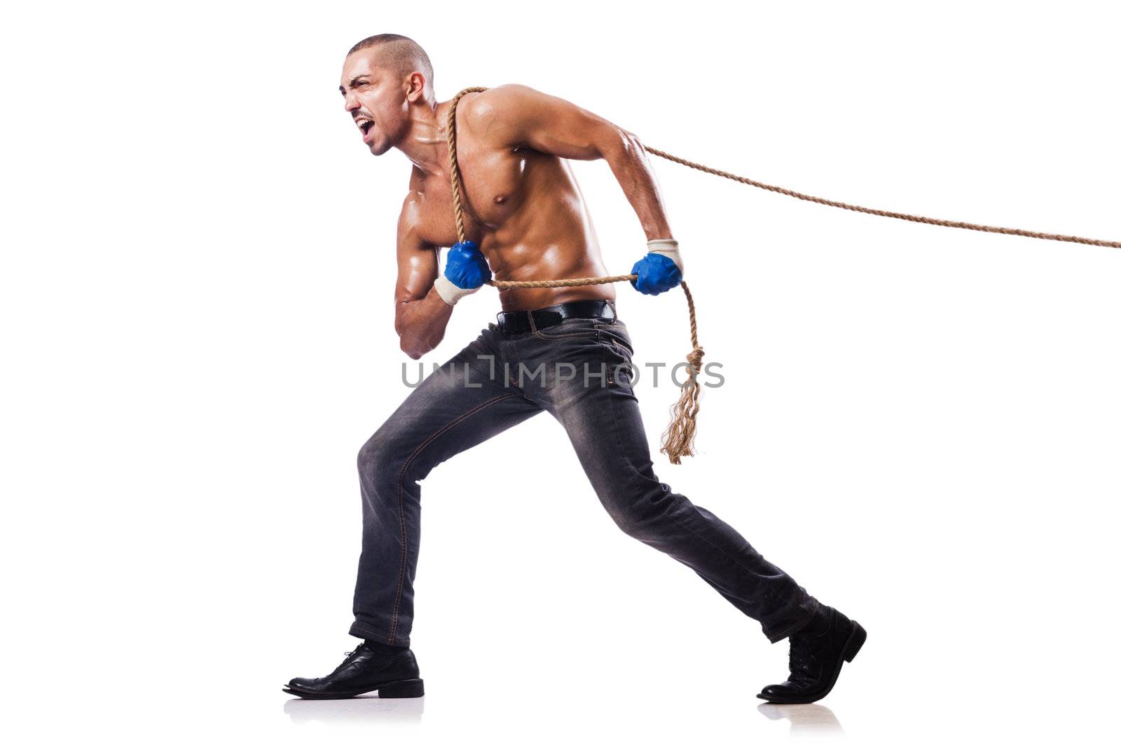 Muscular man pulling the rope by Elnur