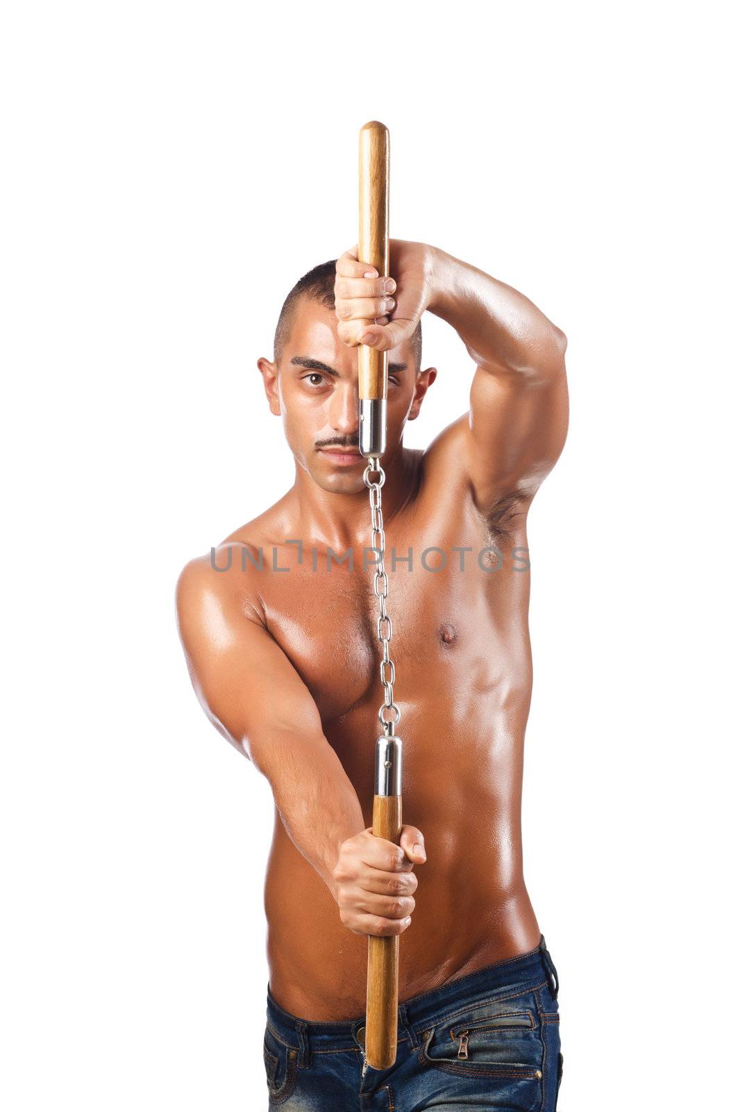 Man in martial arts concept with nunchucks