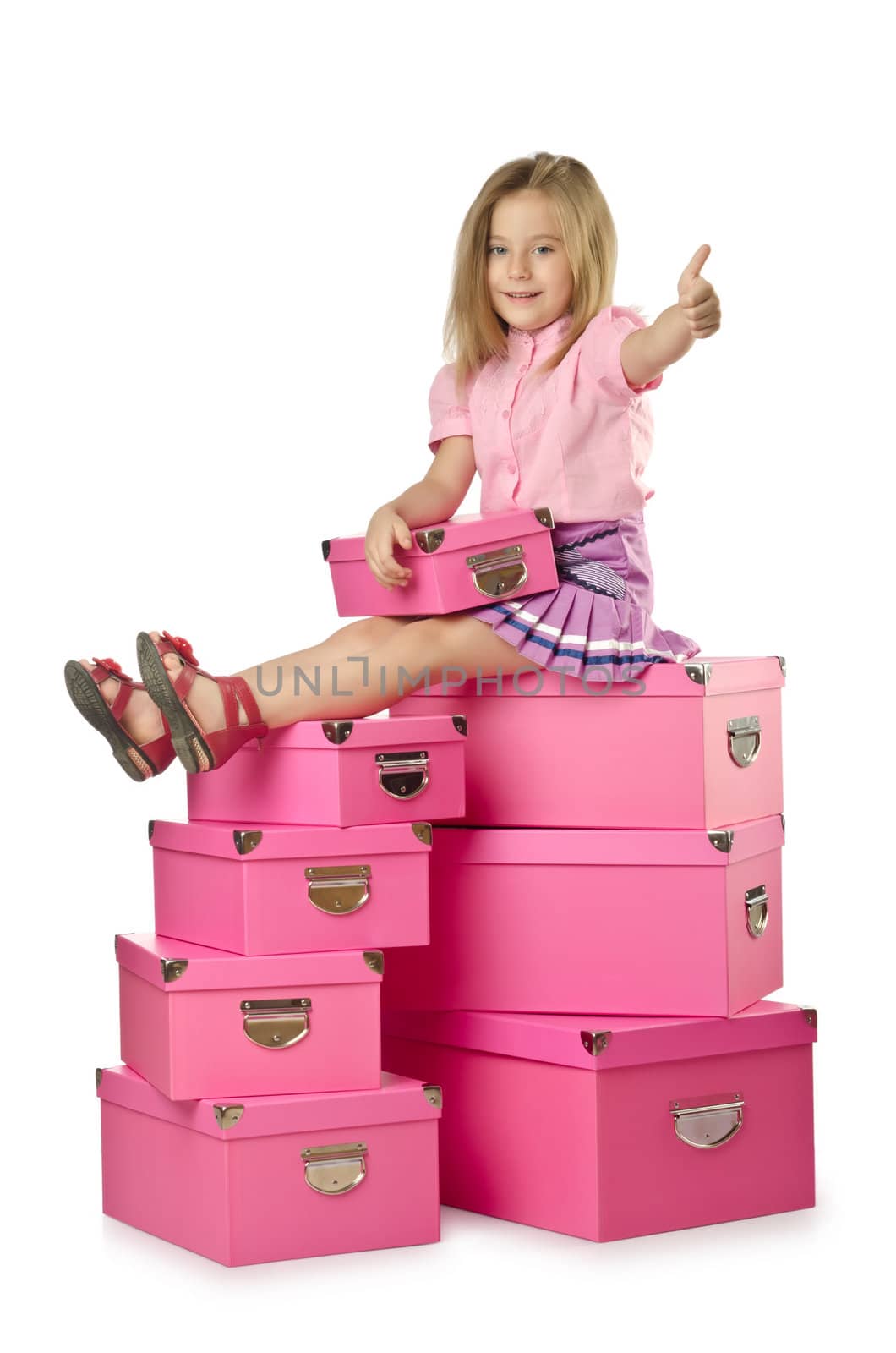 Little cute girl with lots of boxes