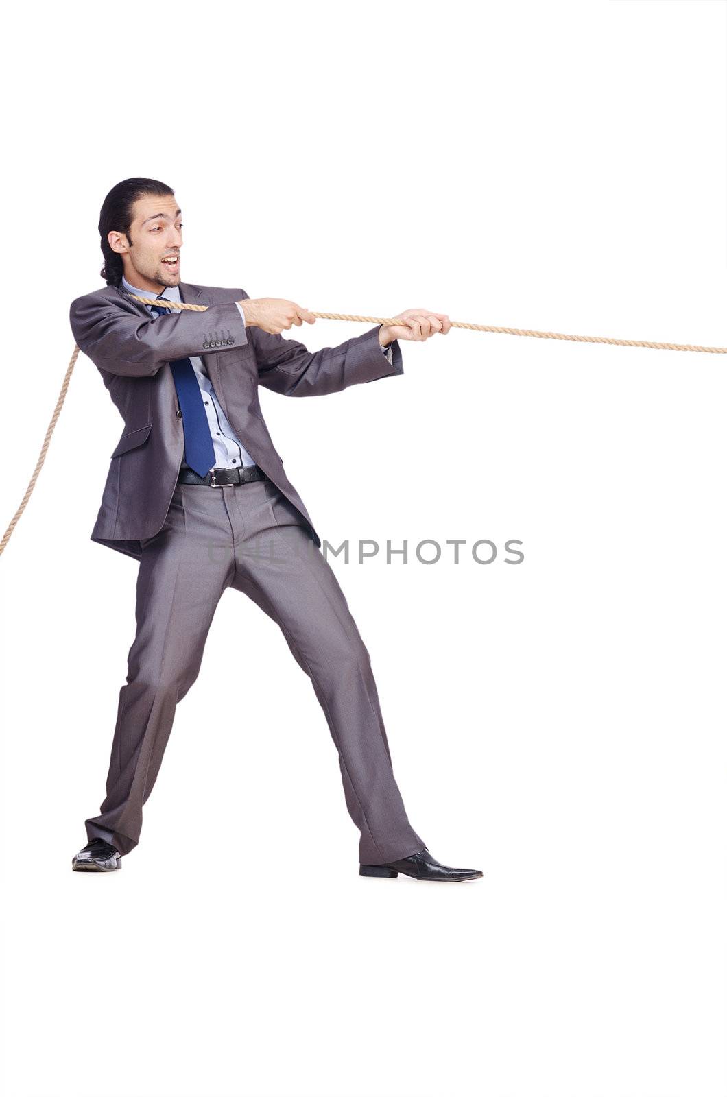 Businessman pulling rope on white