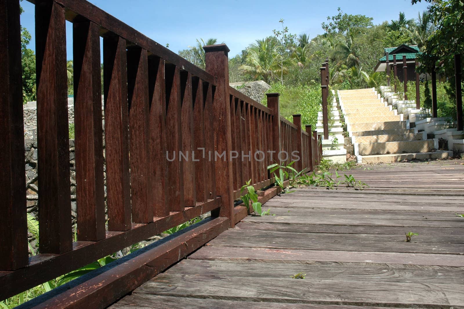 wooden bridge and concrete stairs in a park
