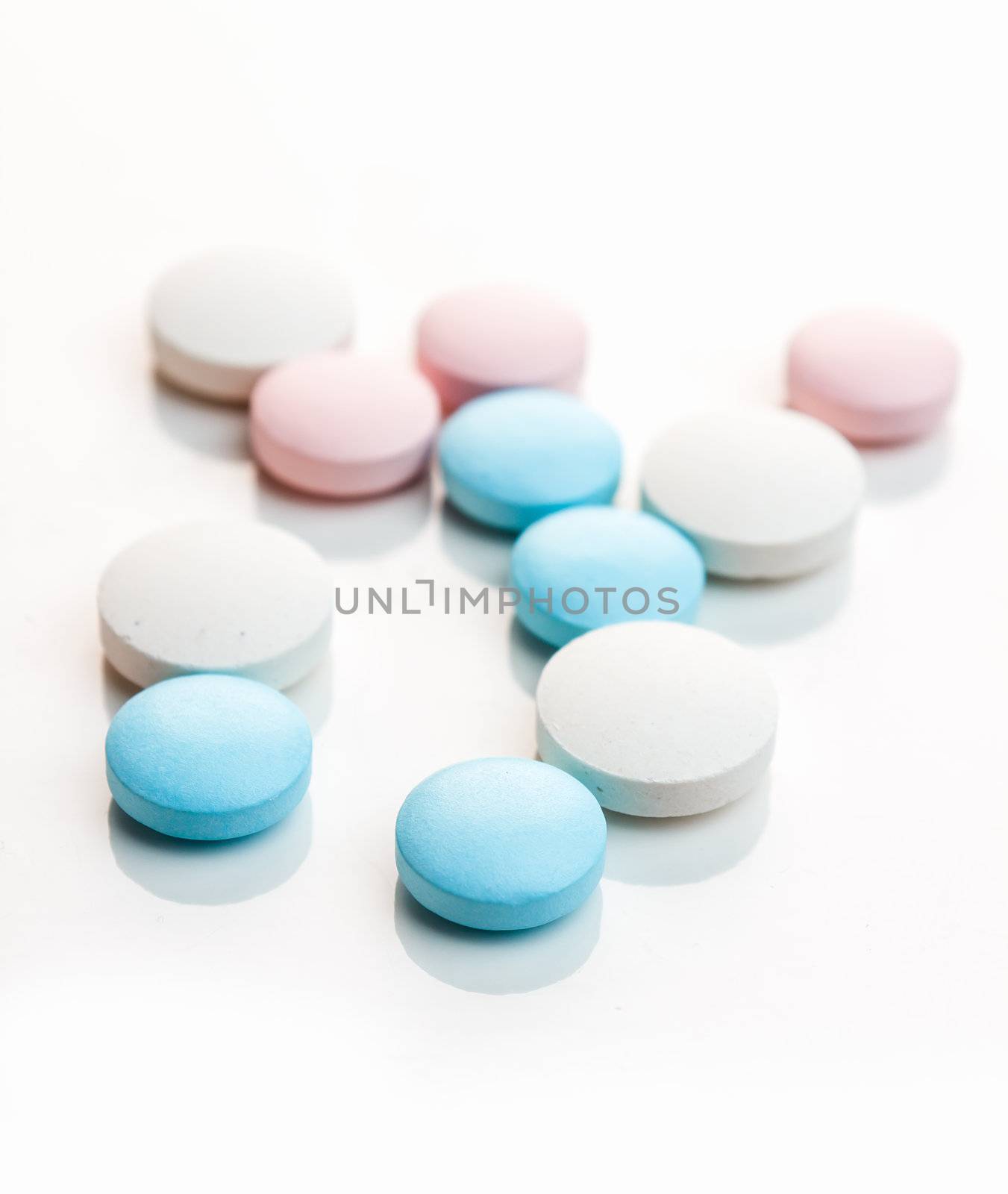 Medical colored pills isolated on white background