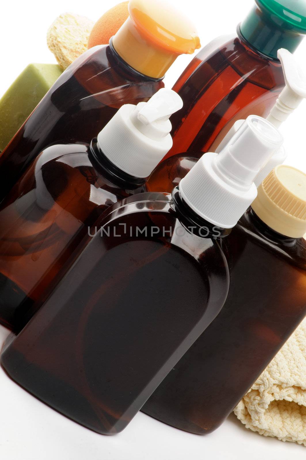 Arrangement of Facial Cosmetics in Brown Containers closeup on white background