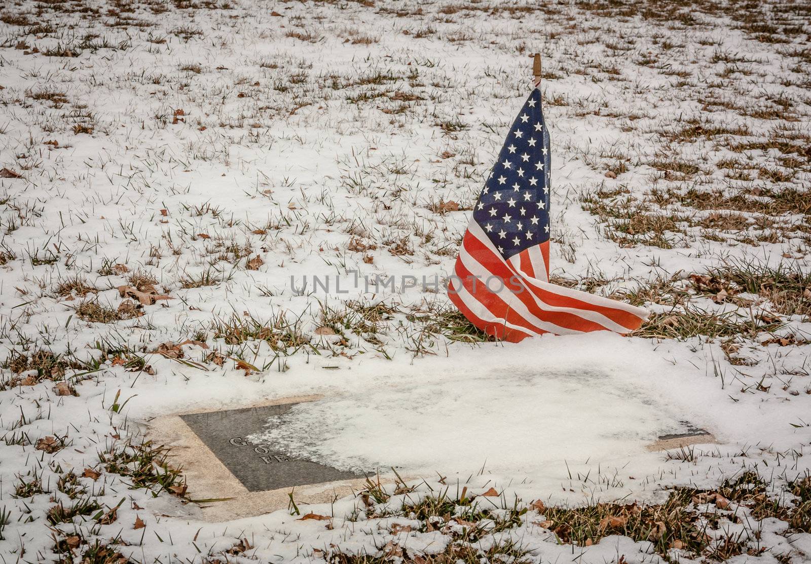 Veteran's Grave in a Rural American Cemetery in Winter by wolterk