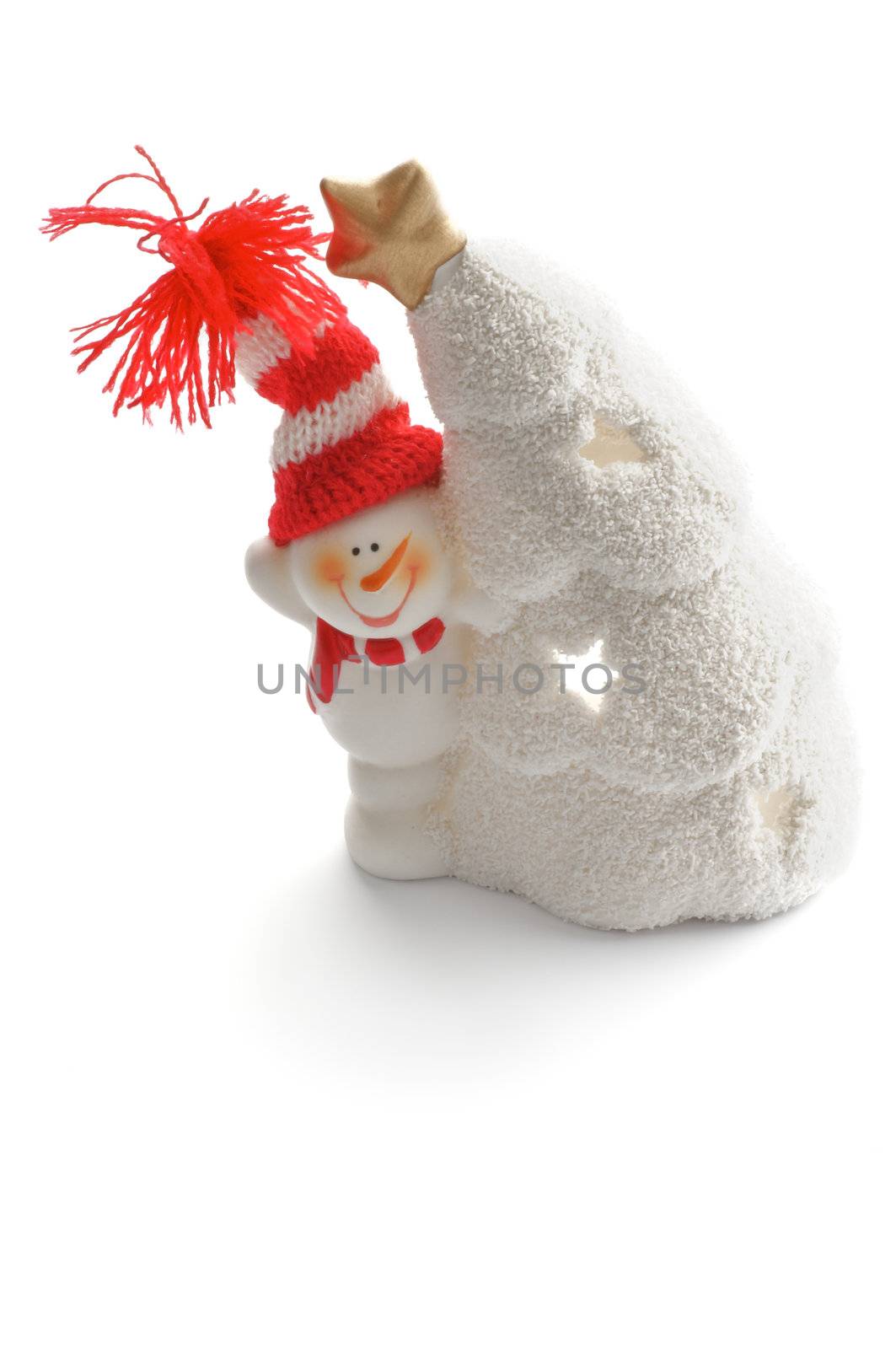 Snowman in Knitted Hat and Snow House as Christmas Decoration closeup on white background